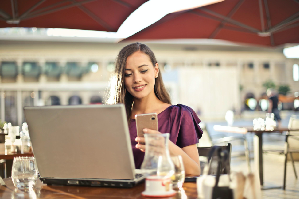 girl using mobile devices in the restaurant