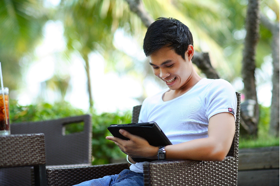 young man using mobile tablets