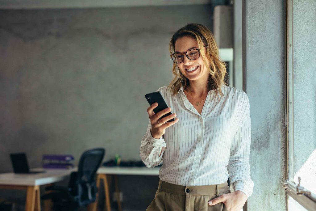 woman using smartphone in the office